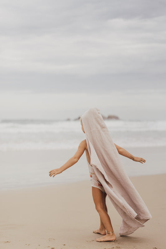 child on beach earth day 2022 living sustainably