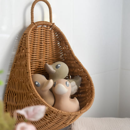 bath storage basket woven from recycled plastic rattan storing three rubber duck bath toys