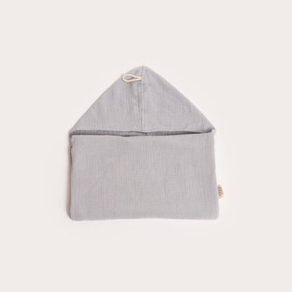 neatly folded light mist blue organic hooded cotton children's towel