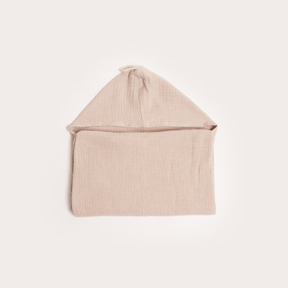 neatly folded neutral tan organic hooded cotton children's towel