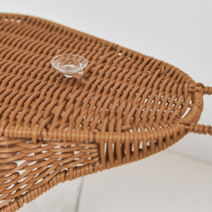 back of the bath storage basket showing suction cap, woven from recycled plastic rattan used to store bath toys