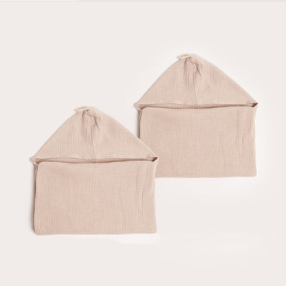 two neatly folded neutral tan latte organic hooded cotton children's towel